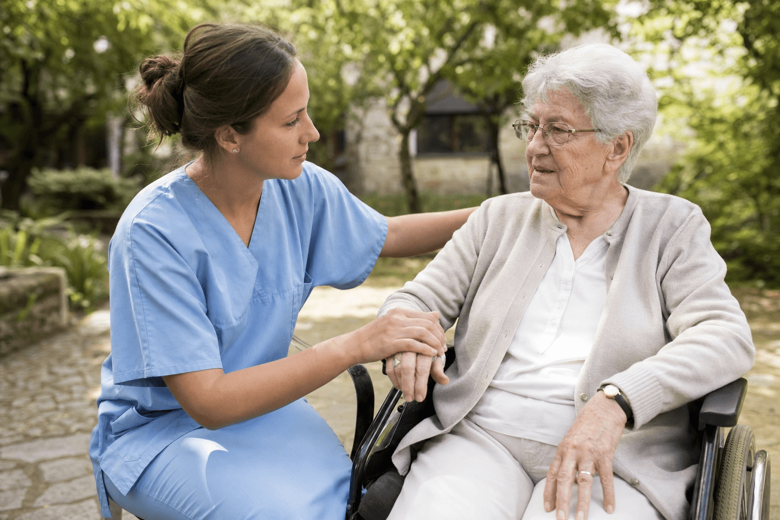 Registered nurse providing compassionate care to a participant in a warm outdoor setting